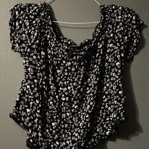 Black off the shoulder top with blue and white floral design